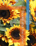 A book cover for "Bloom after the storm" by Courtney Valenzuela, featuring a vibrant floral arrangement of sunflowers with yellow petals and brown centers. The title and author name are overlaid in white text against a translucent orange and blue rectangular frame.